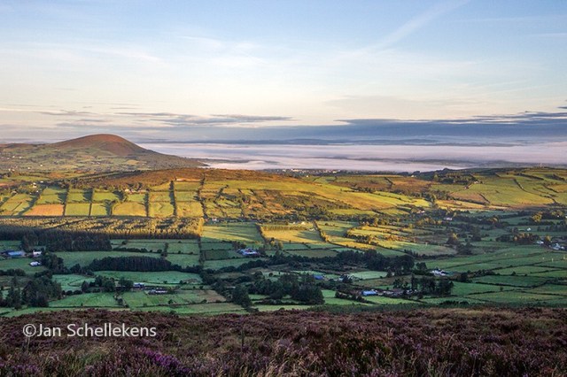 Overlooking the lower land covered by clouds